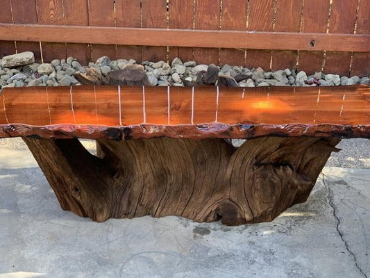 A live-edge wooden epoxy bench. The epoxy used was carefully measured before mixing and pouring, for optimal results.