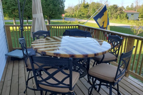 A photo of an epoxy table top with a smooth coating and some cured epoxy drips.