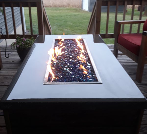 A fire pit surrounded by an epoxy-coated surface.