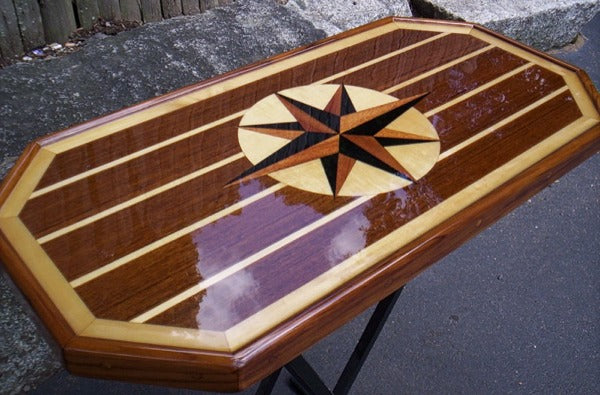 A wooden epoxy table with a perfectly poured coating.