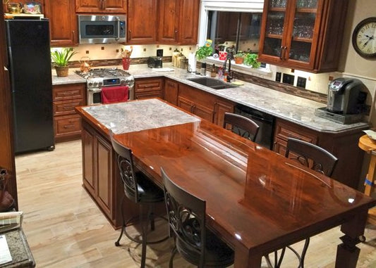 A kitchen with wooden epoxy countertops and granite epoxy countertops.